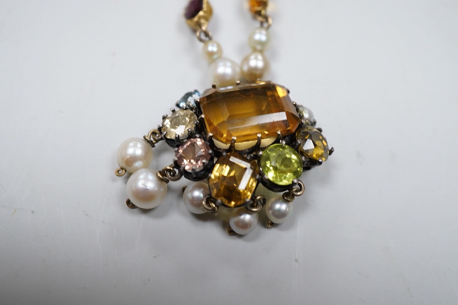 An Arts & Crafts gem-set and pearl necklace, circa 1900, composite, set with variously cut stones including citrine, amethyst, peridot, tourmaline and zircon, and pearls, length 42cm, pearls untested, Condition: good, ty